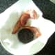 Bacon and black pudding are drained on kitchen paper