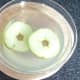 Sliced apple in water and lemon juice