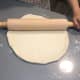 Roll the dough with a rolling pin. 