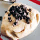 Transfer the dough onto a baking mat, combine the chocolate chips, and knead for 10 minutes. 