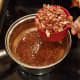 Remove from heat and add your vanilla extract and pecans.