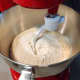 In a mixing bowl, combine the flour with the yeast mixture and beat until it is all combined.