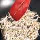 Fry the anchovies with some oil in a wok over medium heat.