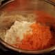 Add in your diced onion and shredded carrot.