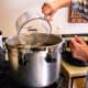 Add to your canner 2 quarts of water, or whatever the manufacturer recommends.