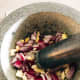 Combine the chopped ingredients in the mortar. Pound it until it forms a paste.