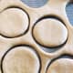 Shape the donuts using a donut cutter.