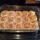 When your cinnamon rolls come out, wait for them to cool a bit before spreading them with icing. Enjoy!