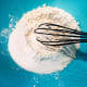 In a mixing bowl, combine the flour, sugar, baking powder, and salt. Use a whisk to combine the dry ingredients.