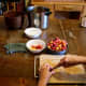 Using a sharp paring knife, slit open each plum, making a whole through which you can squeeze the seed.