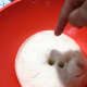 Poke the dough with your finger to let the air out.