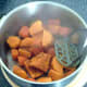 Mashing sweet potatoes and carrot
