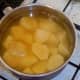 Potatoes are boiled in water with turmeric and salt