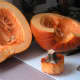 Remove the stem and cut the gourd in half, lengthwise using a sharp knife.