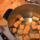 Place the cubes into a deep stew pot.
