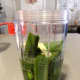 Take the pandan leaves and place them into a blender. Pour in some water and blend until fine.