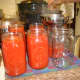 When finished, pour the sauce into pre-warmed canning jars.