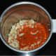 Add the peanuts, red chili powder, garlic, and cumin seeds to a blender. Pulse 2–3 times to get a coarse powder. Add salt and pulse once again.