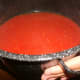 After evaporation, the sauce is a beautiful red color. Bring it back inside to finish on the stove.