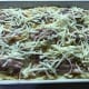 Add the grated cheese and pop it into the oven.