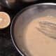Creamy Caesar salad dressing ready to be applied.