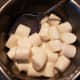 Place 15 to 20 marshmallows in a greased sauce pan. Add enough water to cover the bottom of the pan.