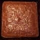 Bake the brownies according to the box mix. Allow the brownies to cool completely before decorating.