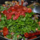 Step 2: Throw in chopped green leafy veggies, chopped tomatoes, sugar, and salt.