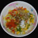 Add ingredients to a mixing bowl. Add red chili powder, roasted cumin seeds, chat masala powder, and salt. Mix well.