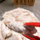 Turn chicken to get flour on both sides and shake off any extra.