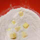 Add the butter and use your hands to combine the butter with the flour mixture.