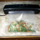 Just before the bag of food is processed by Slaouwo V2 Vacuum Sealer