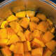 Cut the pumpkin into chunks and throw them into a pot filled with water.