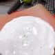 Take some fresh grated lime zest and sprinkle on top of the first cake.