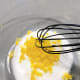 Add the freshly grated lemon zest into the sugar. Use a whisk to combine. 