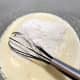 Gradually add the flour mixture into the batter. 