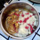 Mash and red chilli are added to curried onion