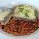Enjoying pie, mash and beans
