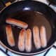 Frying sausages