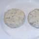 Formed fishcakes on flour