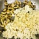 Add in the tofu and garlic powder and give it a good stir. Let it sit to be allow it to get a bit crispy on the bottom, then scrape all the tofu off the pan and stir. Repeat this process until most of the moisture is removed from the tofu.