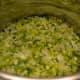 Cook diced vegetables in butter in a large pot. This photo shows the veggies during the cooking process—but they're not ready yet.