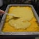 Spread the remaining corn bread batter atop the cheese layer.