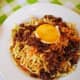 Pancit batil patong: Miki noodles, carabeef meat, and bean sprouts, topped with fried egg and often served with a small bowl of egg-drop soup (hence the names "batil" and "patong"). Comes from Tuguegarao, Philippines.