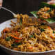 Pancit habhab: Thin miki noodles, pork meat, pork liver, shrimp, vegetables, and cane vinegar. The vinegar is a substitute for calamansi juice, which is a common condiment for all types of pancit.