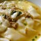 Pancit langlang: A delicious broth made of flat miki noodles, shredded adobo meat (pork or chicken), chicharon (pork cracklings), and onions. Hails from Imus, Cavite.