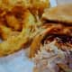 Pulled pork sandwich with onion rings 