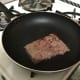 Slip a brick of meat in a hot pan
