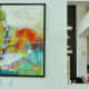 Entrance art with cutout view of dining room