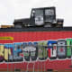 Brewston graphic mural by Alex Roman Jr., aka Donkeeboy